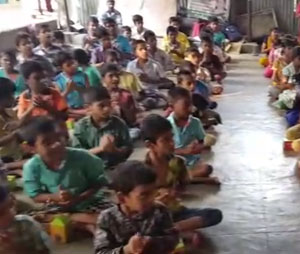 Children at PHIN Deaf School sharing things with volunteers